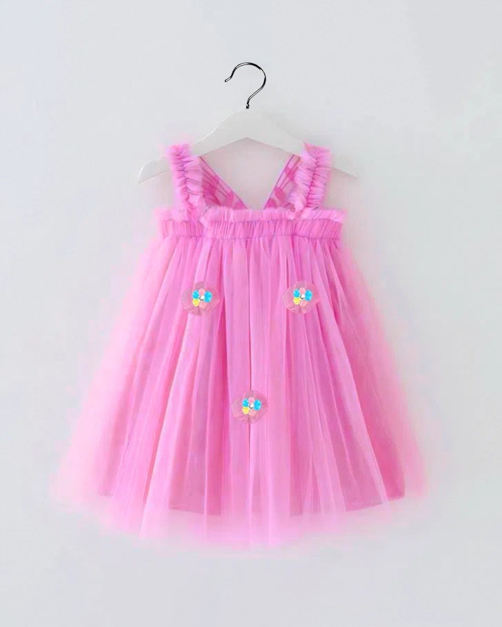 Pink dress with floral designs on a white background